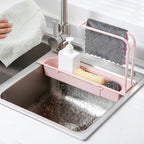 Soap and sponge holder with integrated towel bar for quick drying