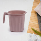 Four square bath mugs in transparent mixed colors, stacked neatly.