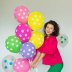 Multicolor balloons creating a cheerful atmosphere for a Holi celebration.