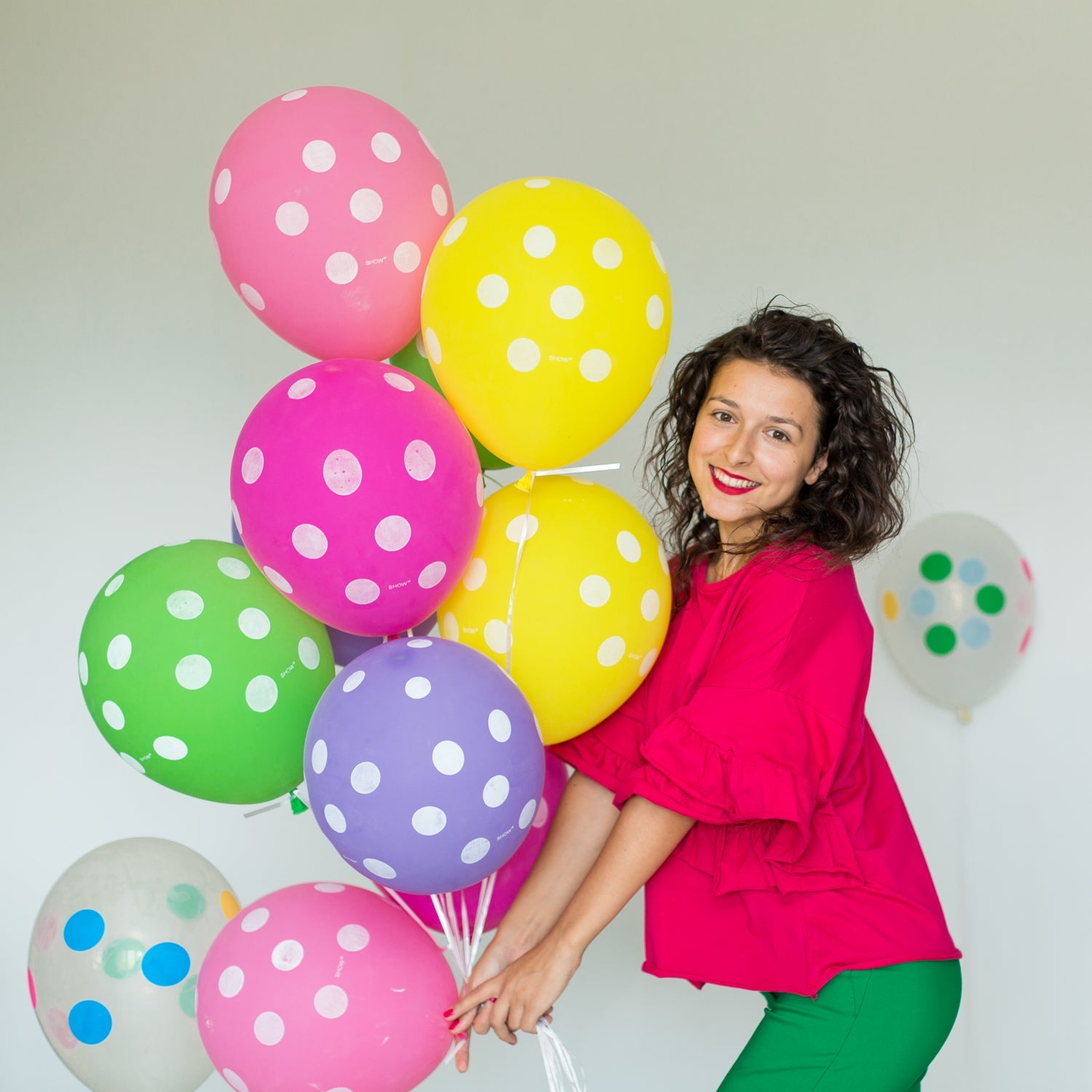 Multicolor balloons creating a cheerful atmosphere for a Holi celebration.