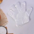 Disposable gloves packaging displaying 100 transparent gloves