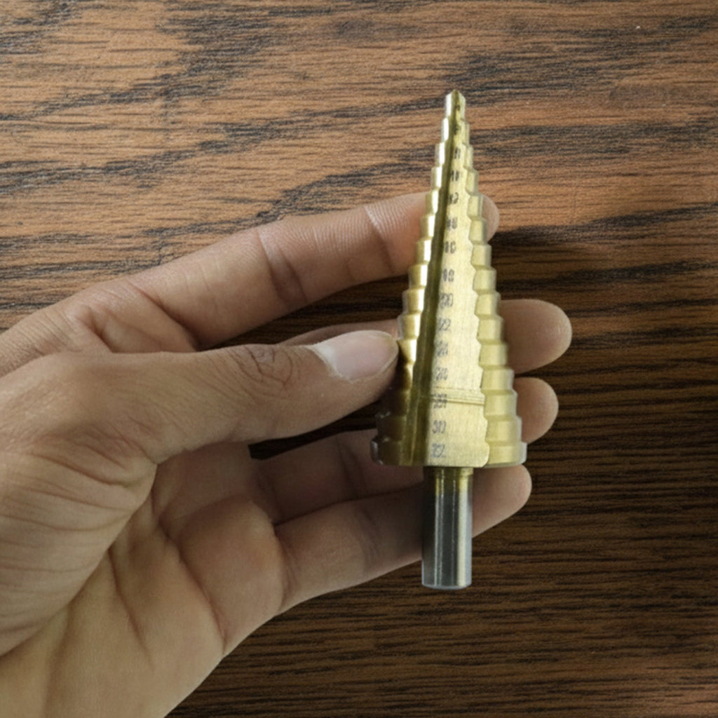 Detailed look at the sharp edges and titanium coating of the HSS steel step drill bits.