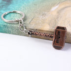 Metal hammer keychain securely holding multiple keys