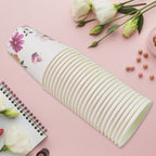 Empty disposable paper cups arranged neatly on a surface.