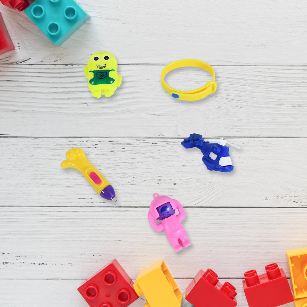 Colorful Kids Toy Combo with a soldier, rattle, and other toys, presented in a traditional Potli bag.