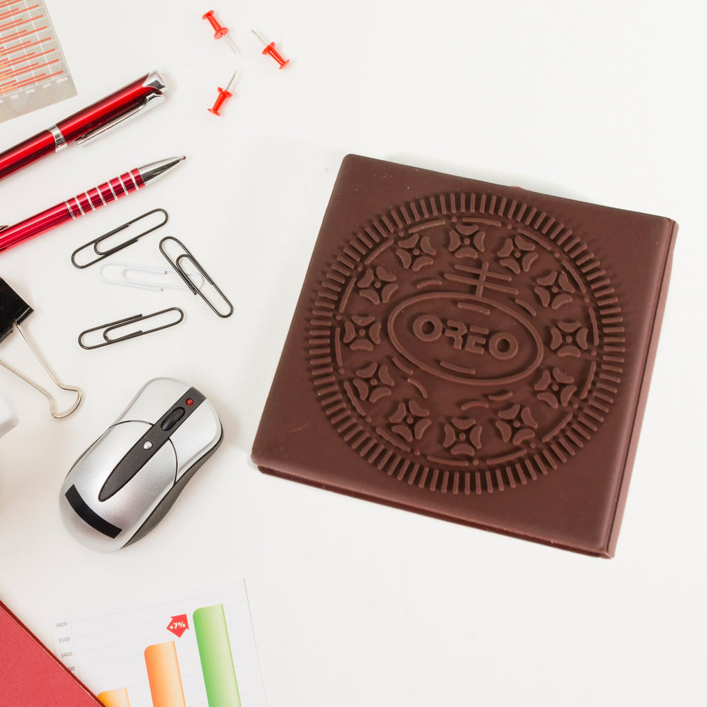 Top-down view of the chocolate scented notebook, emphasizing its compact size.