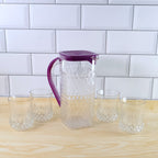 Side view of BPA-free plastic jug and glasses combo set with easy pour design