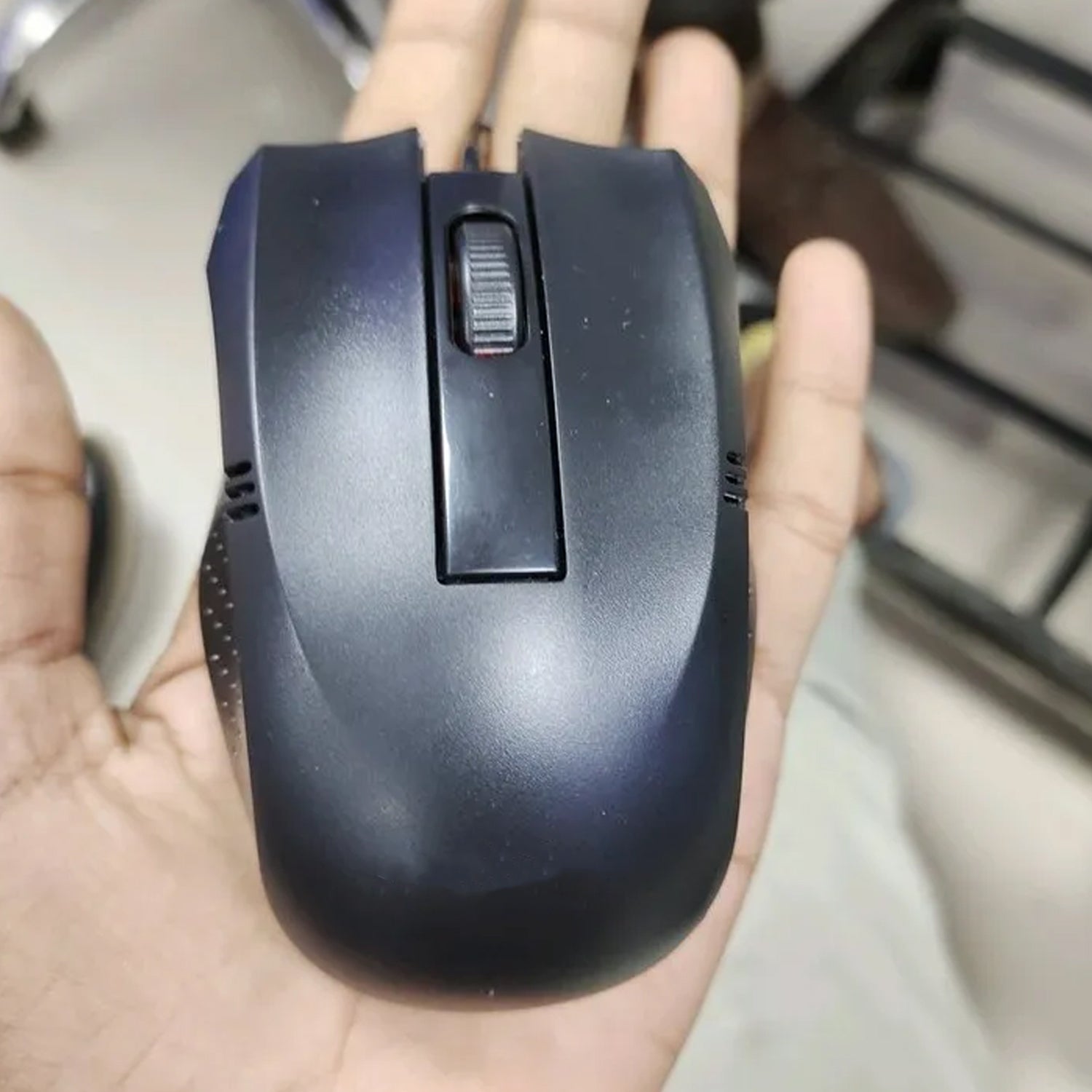 Top-down view of the sleek wired optical mouse, highlighting its simple and functional design.
