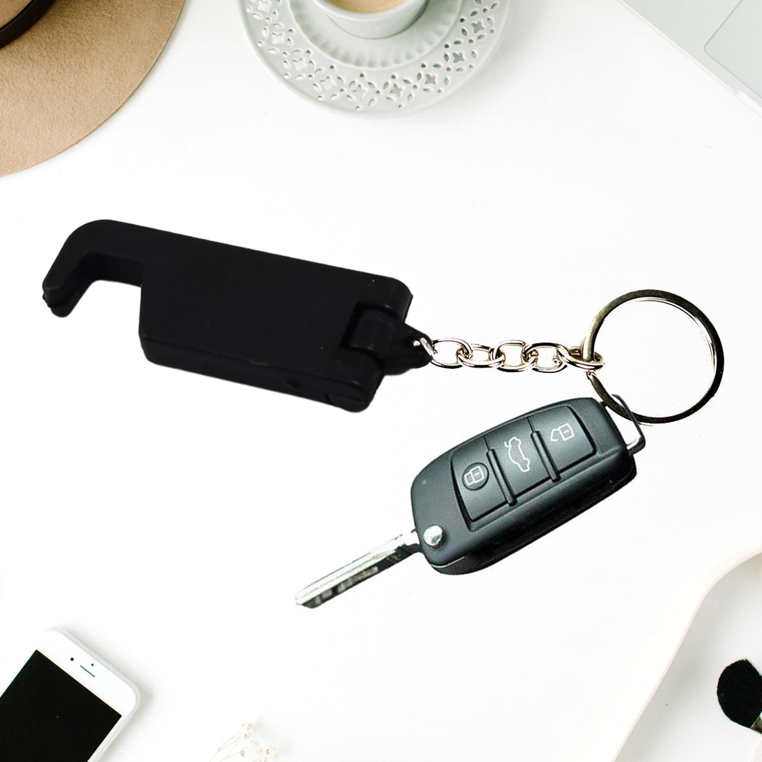 Rear view of the practical keychain mobile stand with its folding mechanism.