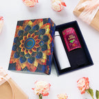 Golden designer gift box containing rose almonds and stainless steel bottle