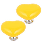 Assortment of colorful heart-shaped cabinet knobs in various shades.