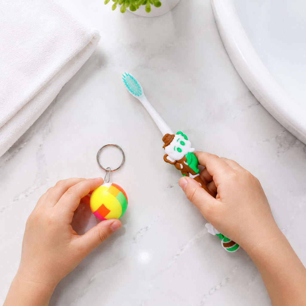 Side view of kids toothbrush and toy ball set packaging with bright design