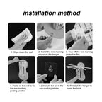 Kitchen utensils hanging securely from the extended hooks of the wall hanger.