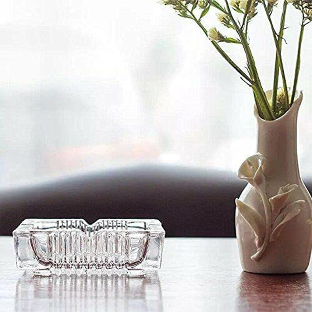 Detailed shot of the polished edges and smooth surface of the square glass ashtray.