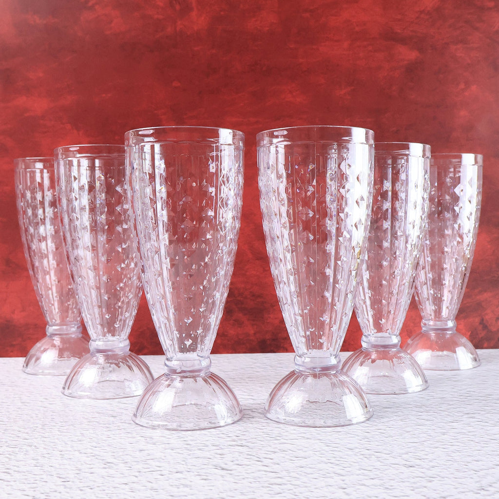 Milkshake glass highlighting footed base and diamond-cut crystal texture