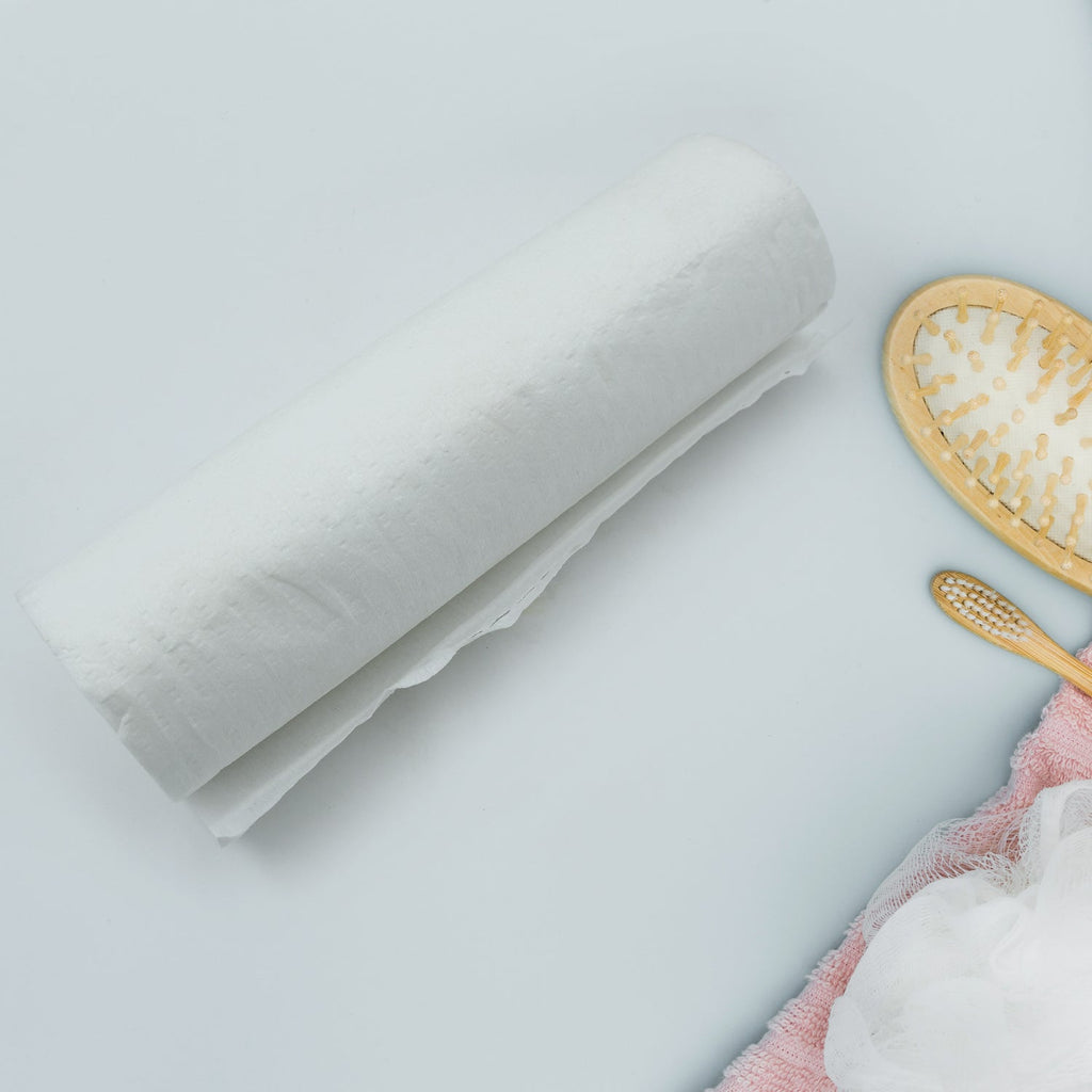 Kitchen tissue roll sheet effectively wiping a kitchen countertop and sink clean.