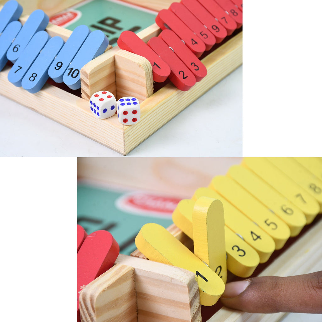 The complete Shut The Box game set, including the wooden board, dice, and storage bag.