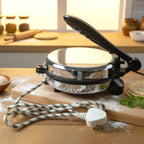Detailed view of stainless steel heating plate in electric roti maker