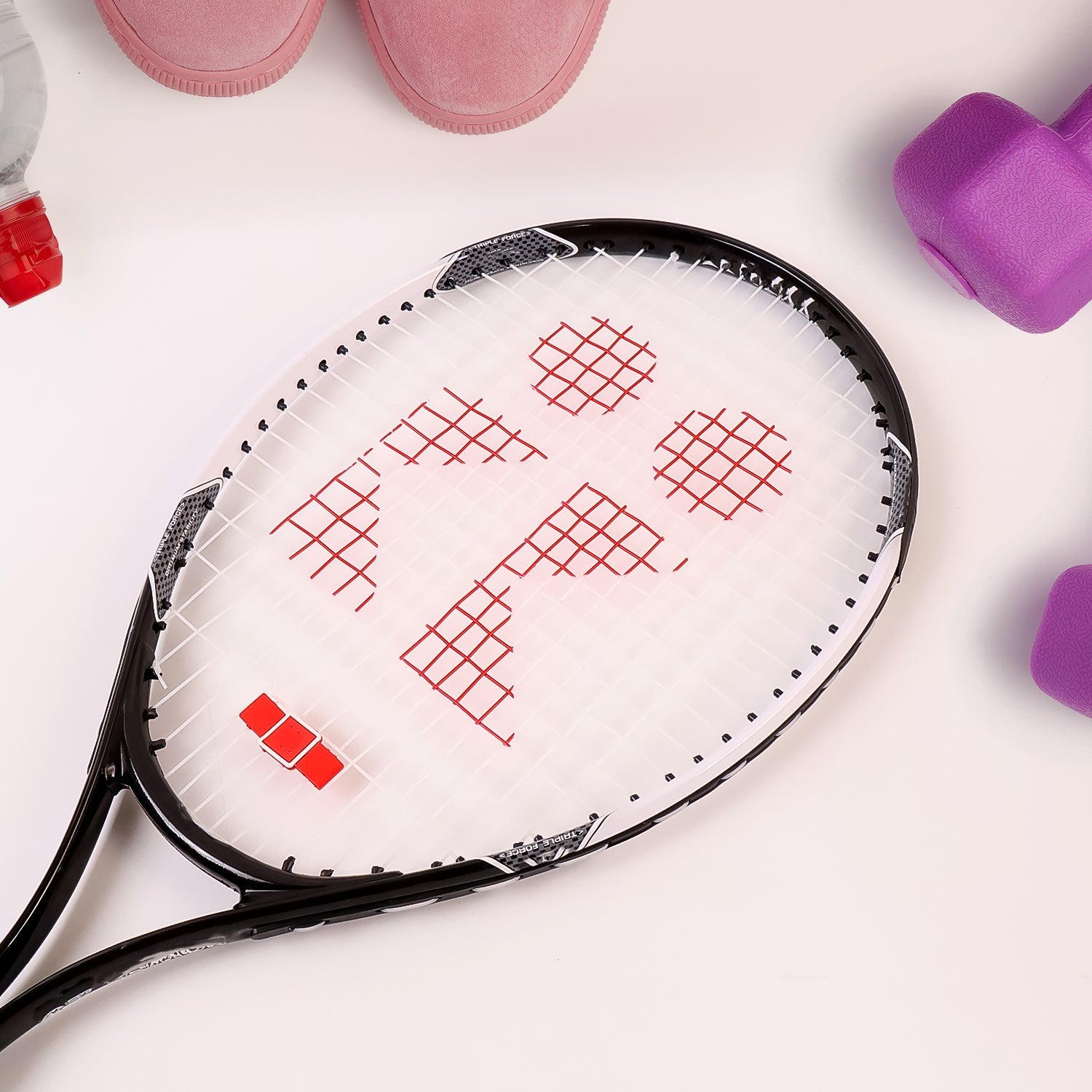 Close-up of lightweight tennis racket nylon strings and aluminium frame