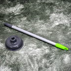 Angled view of a toilet plunger featuring a powerful red rubber cup.