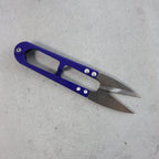 Close-up view of sharp stainless steel blades on sewing scissors