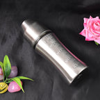 BPA-free stainless steel milk bottle by Ganesh, showing measurements and hygienic cover.