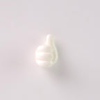 White hand wall clip neatly holding a set of keys