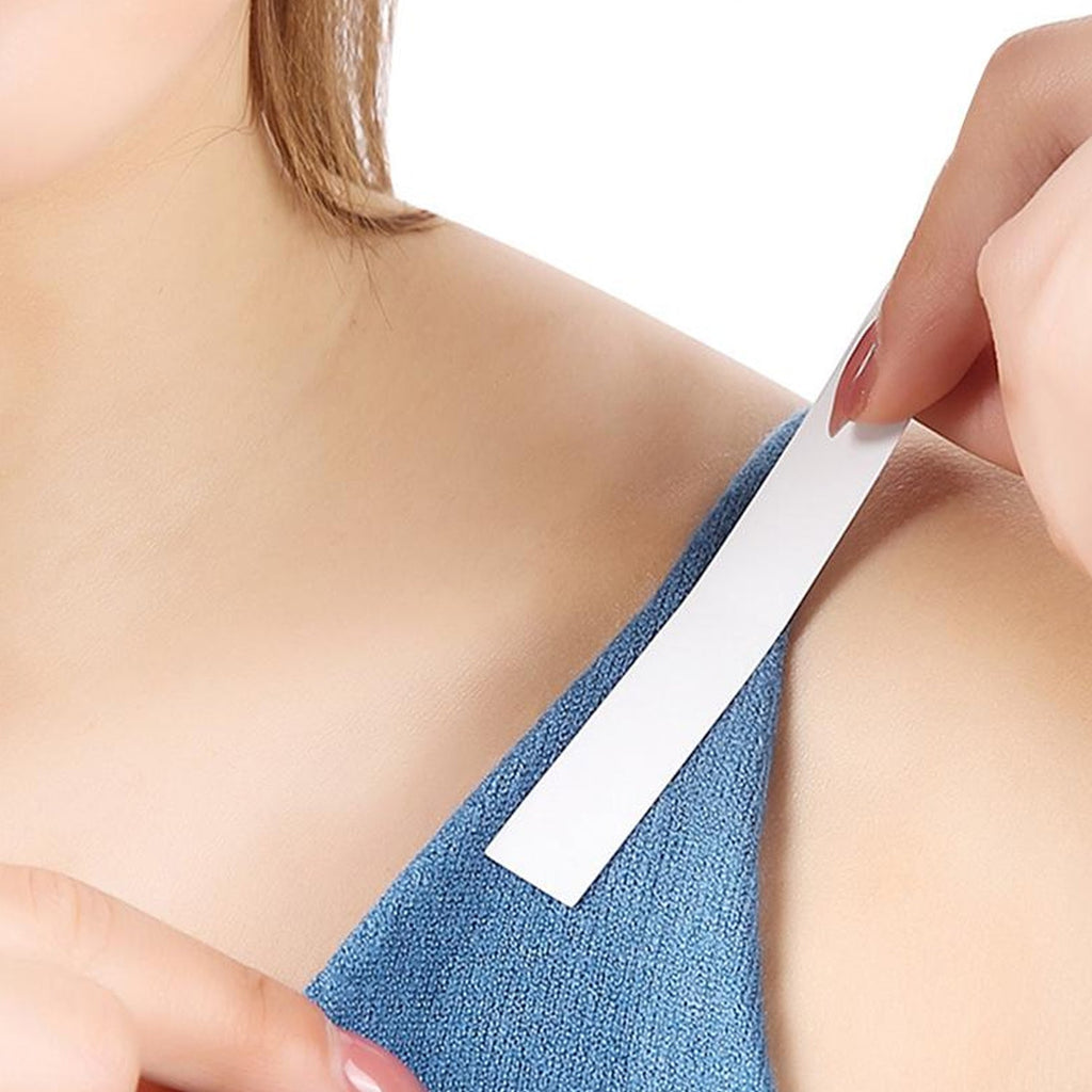 Detailed view of the skin-friendly adhesive side of the clear fashion tape.