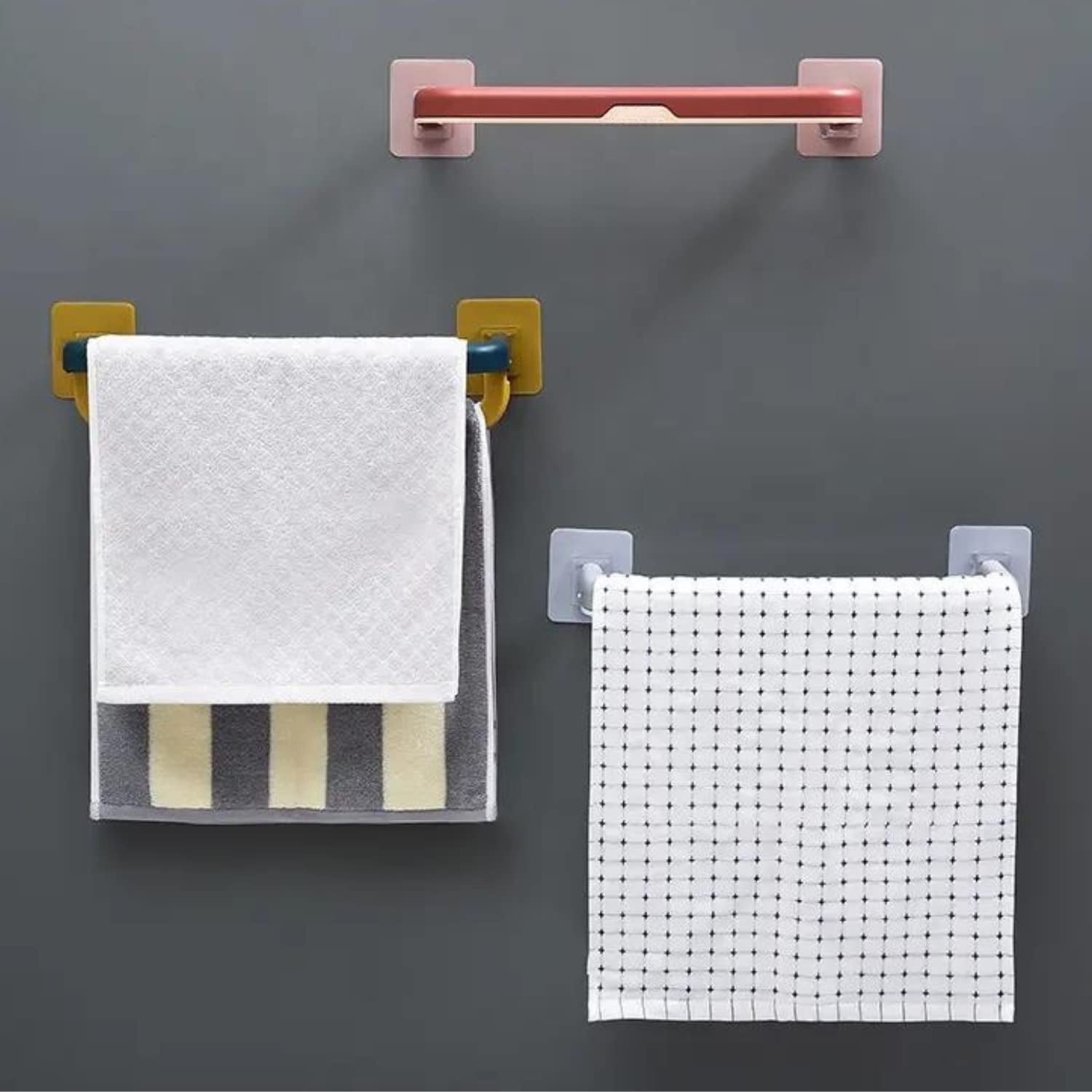 Multifunctional folding towel shelf used in a kitchen for dishcloths and utensils.
