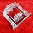 Close-up of silver-coated metal Bal Gopal Jhula swing with intricate engravings