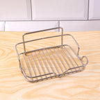 Metal soap holder exhibiting open drain bars to prevent soap mushiness