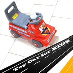 Close-up of the musical horn and steering wheel on the toddler car toy.