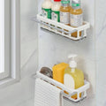 Retractable kitchen sink organizer holding sponges and a dishcloth, enhancing kitchen hygiene.