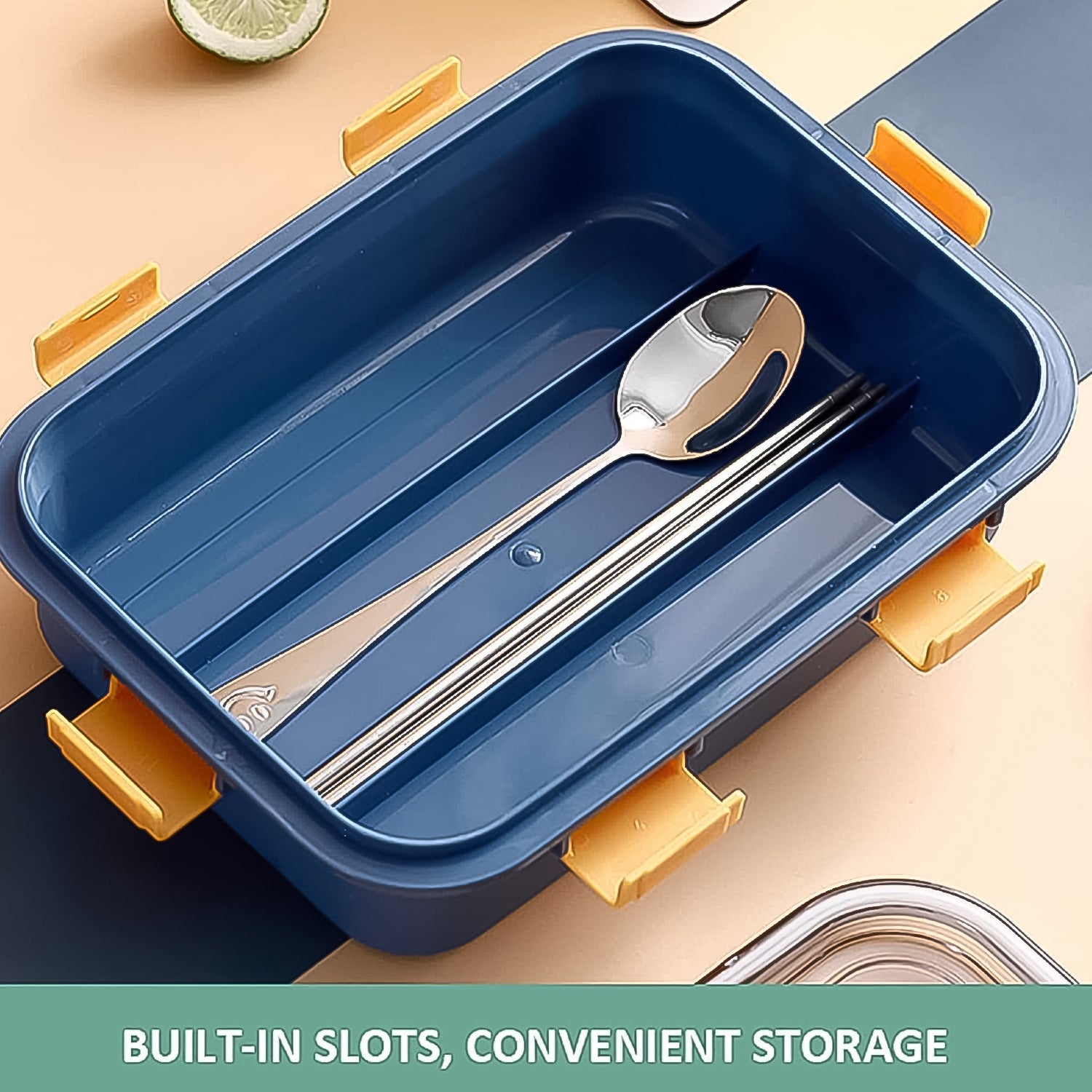Top-down view of the transparent lid on a 3-compartment stainless steel lunch box.