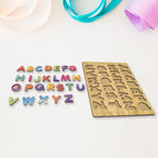 Close-up of a child placing a letter piece into the wooden ABC puzzle board.