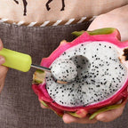 Close-up view of the durable stainless steel scoops of the fruit baller.