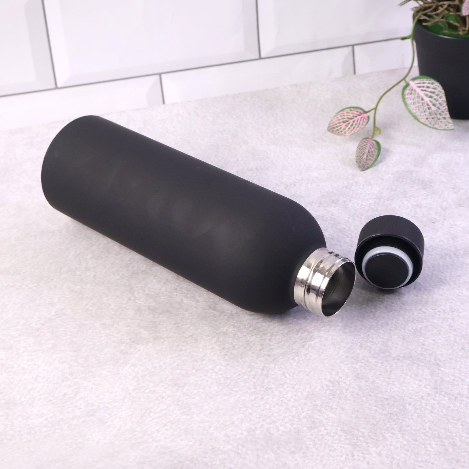 Portable black stainless steel hydration bottle with leak-proof cap