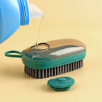 Hydraulic liquid dispensing cleaning brush with dense bristles for effective dirt removal