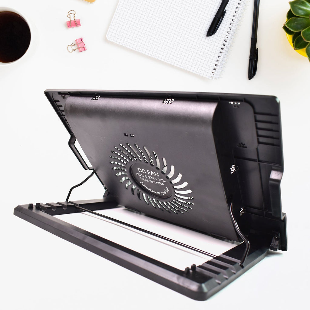 Portable laptop cooler with dual USB ports and fan, ideal for extended use.