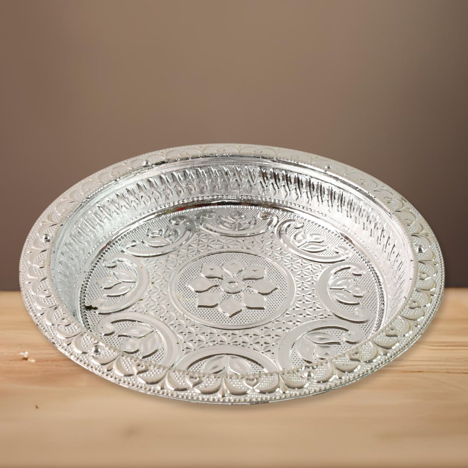 Lightweight plastic pooja thali with traditional silver tone finish