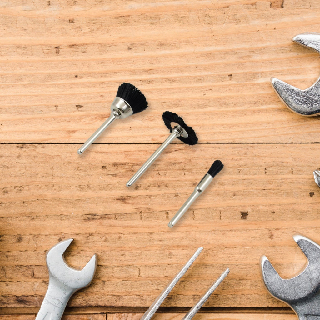 T-shaped brass wire wheel effectively removing stubborn rust from a metal surface.