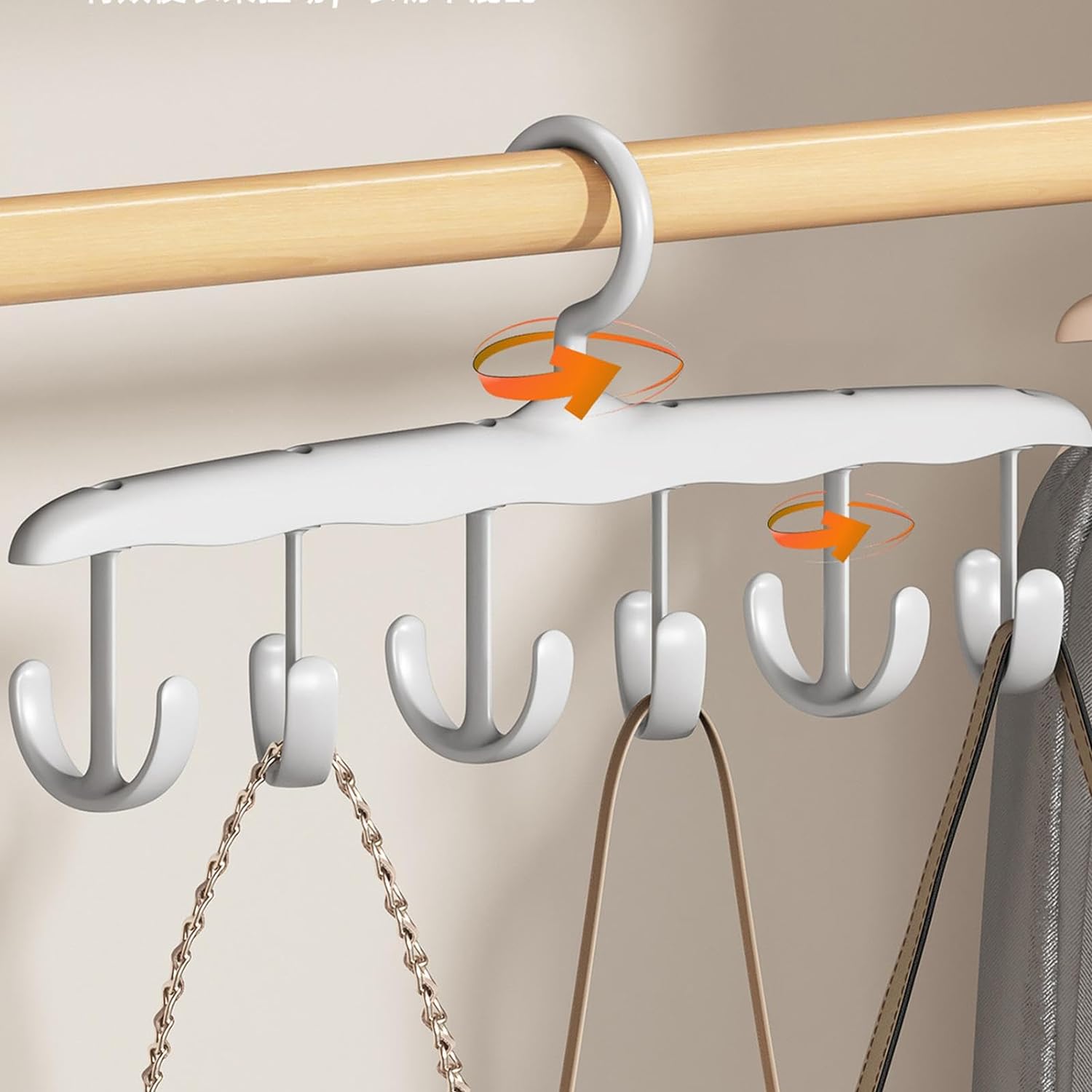Rotatable 12-hook tank top hanger holding multiple tank tops in a modern closet.