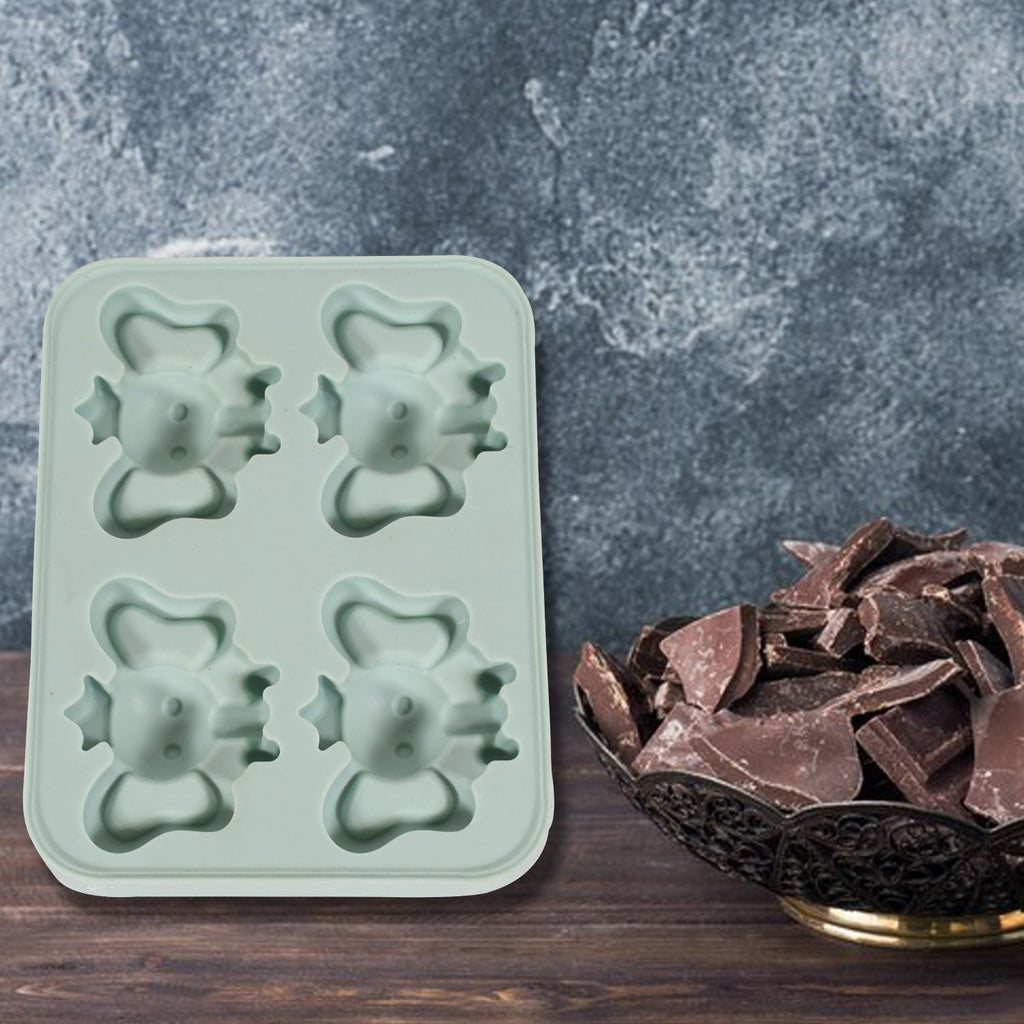 A hand demonstrating the easy push-out feature of the silicone ice tray.