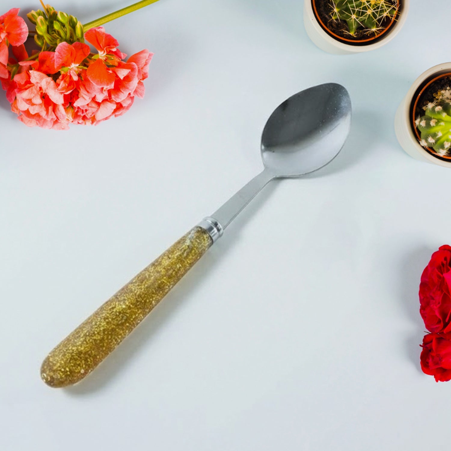 Elegant stainless steel dining spoon set with decorative handles for serving