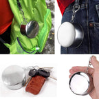 Folded stainless steel camping cup emphasizing space-saving design.