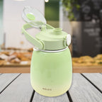 The 1200ml travel mug with its lid open, revealing a straw and included sticker sheet.