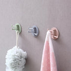 Easy-to-install punch-free sticky hook effectively storing items in a kitchen setting.