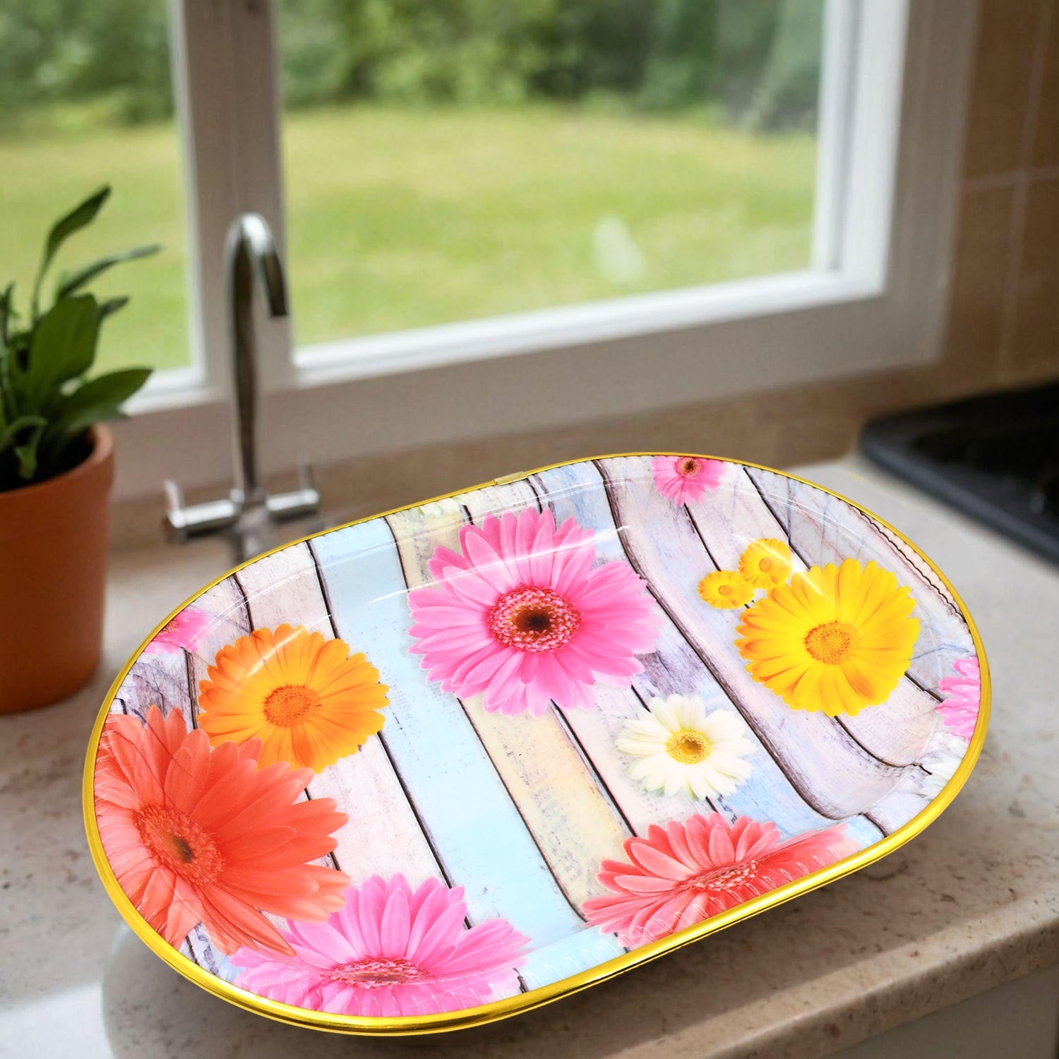 Stylish plastic serving tray with a vibrant floral pattern on a kitchen counter.