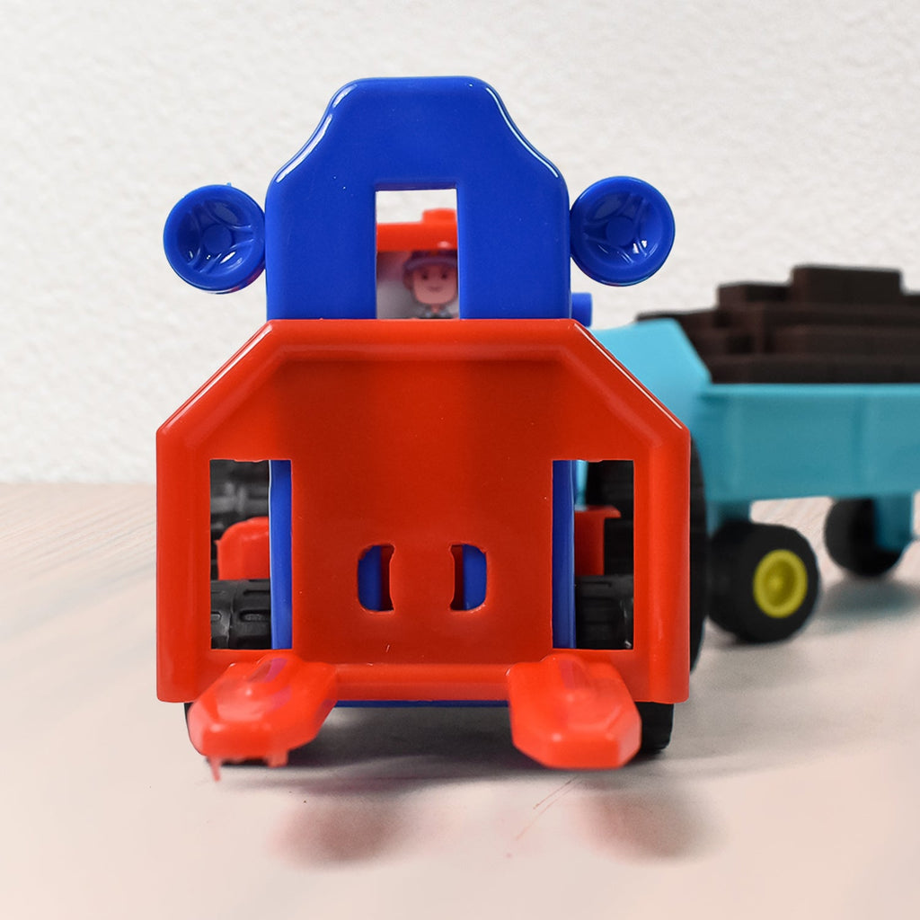 Top-down view of the sturdy plastic friction tractor, ideal for little hands.