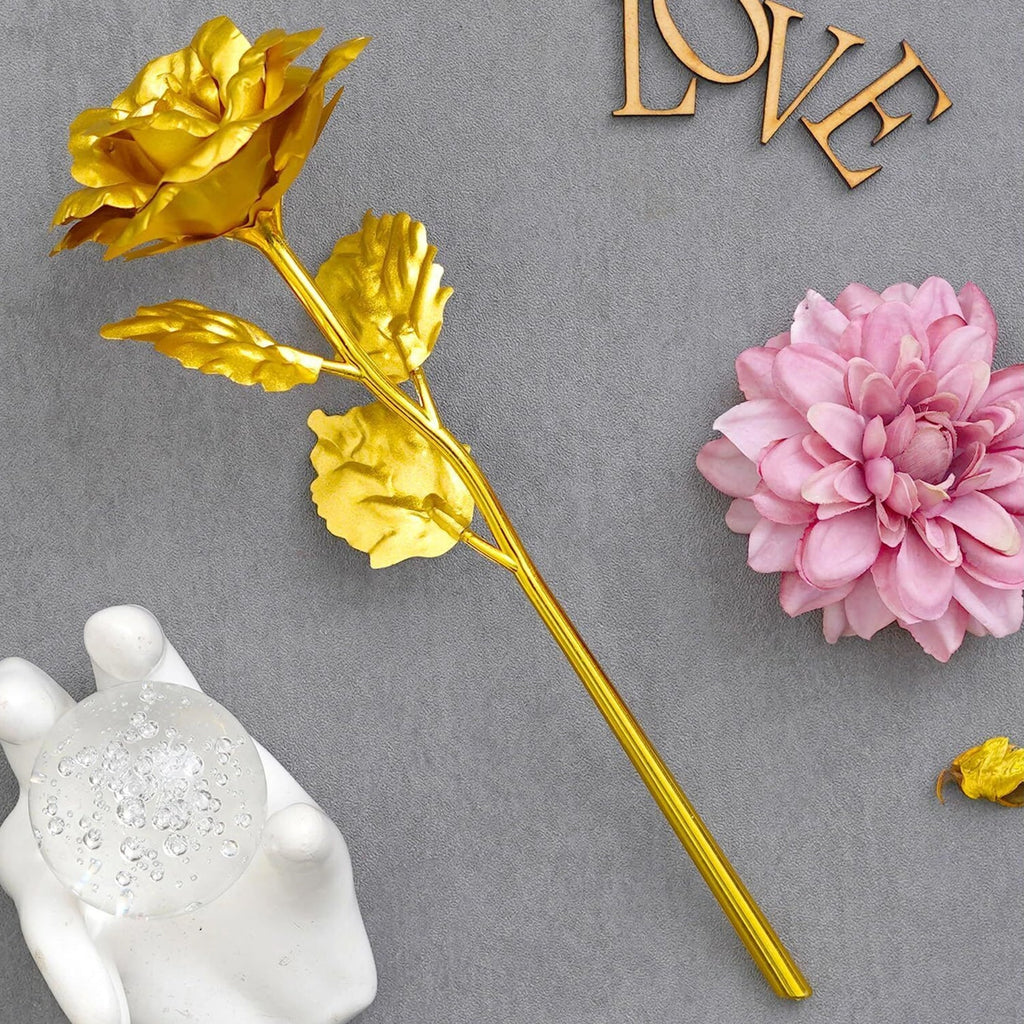 Close-up of luxury golden rose and rose almonds gift set